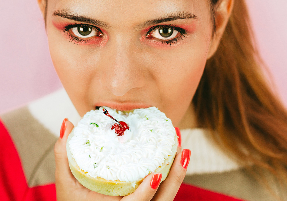 woman eating dessert