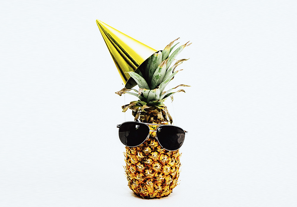 Pineapple with party hat sunglasses